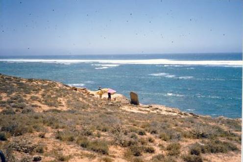 Carrying board and sail past tombstone